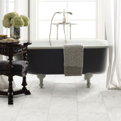 white stone tile flooring in a bright and charming North Carolina bathroom